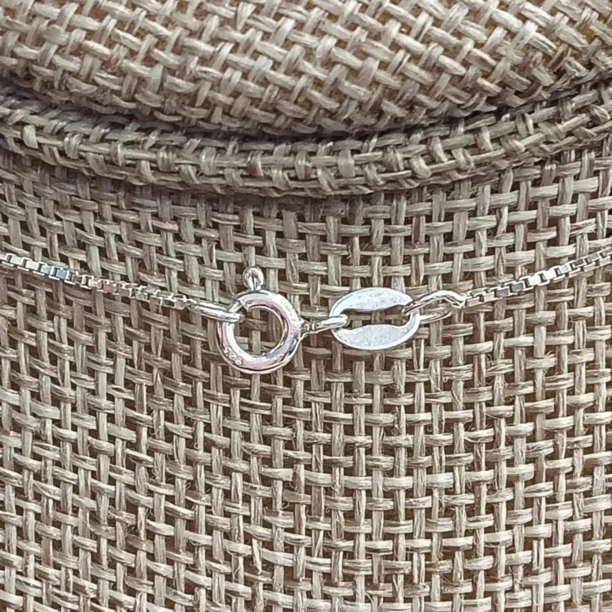 This is a close up of the Sterling Silver spring ring clasp on this blue Topaz necklace