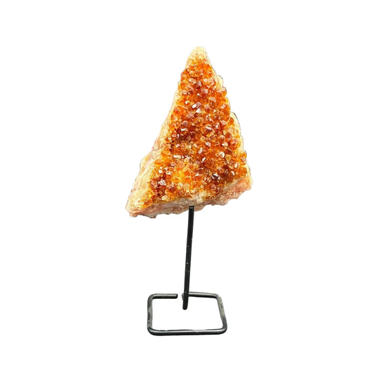 Front side of this citrine on stand, in front of a white background.
