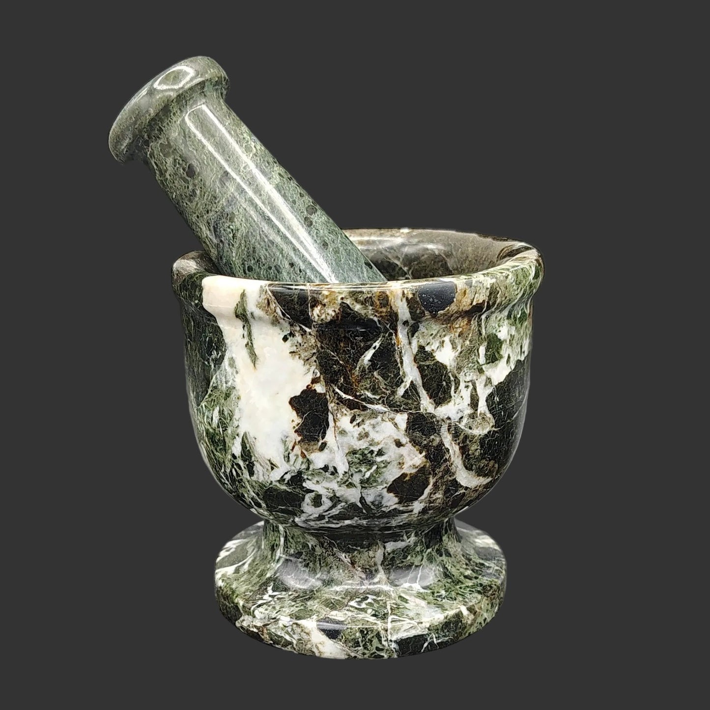 Front view of this Onyx mortar and pestle is marbled with the colors brown, green and white.