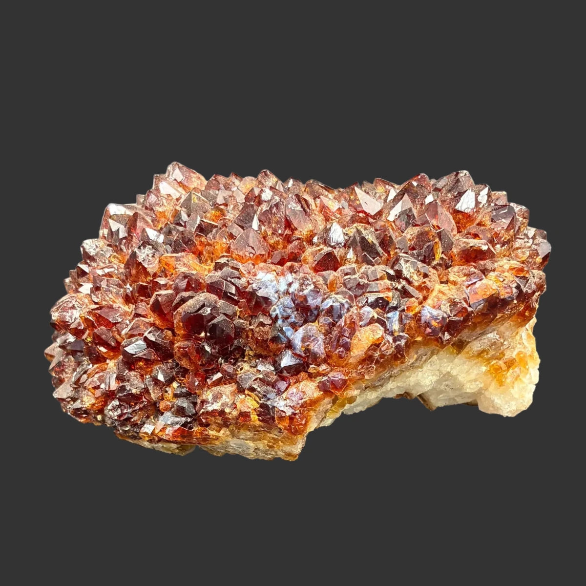 Side view of this citrine specimen, in front a black background.