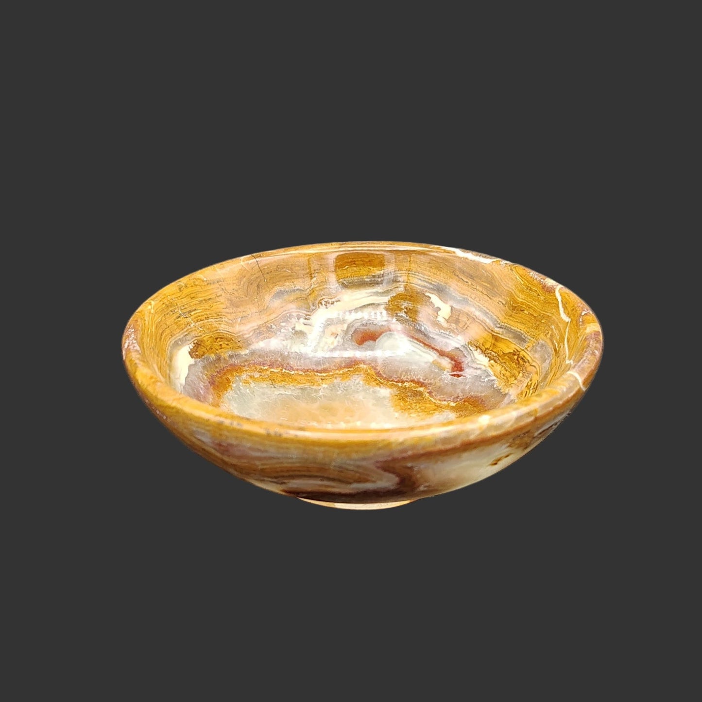 This is the front side of this small, banded onyx bowl.