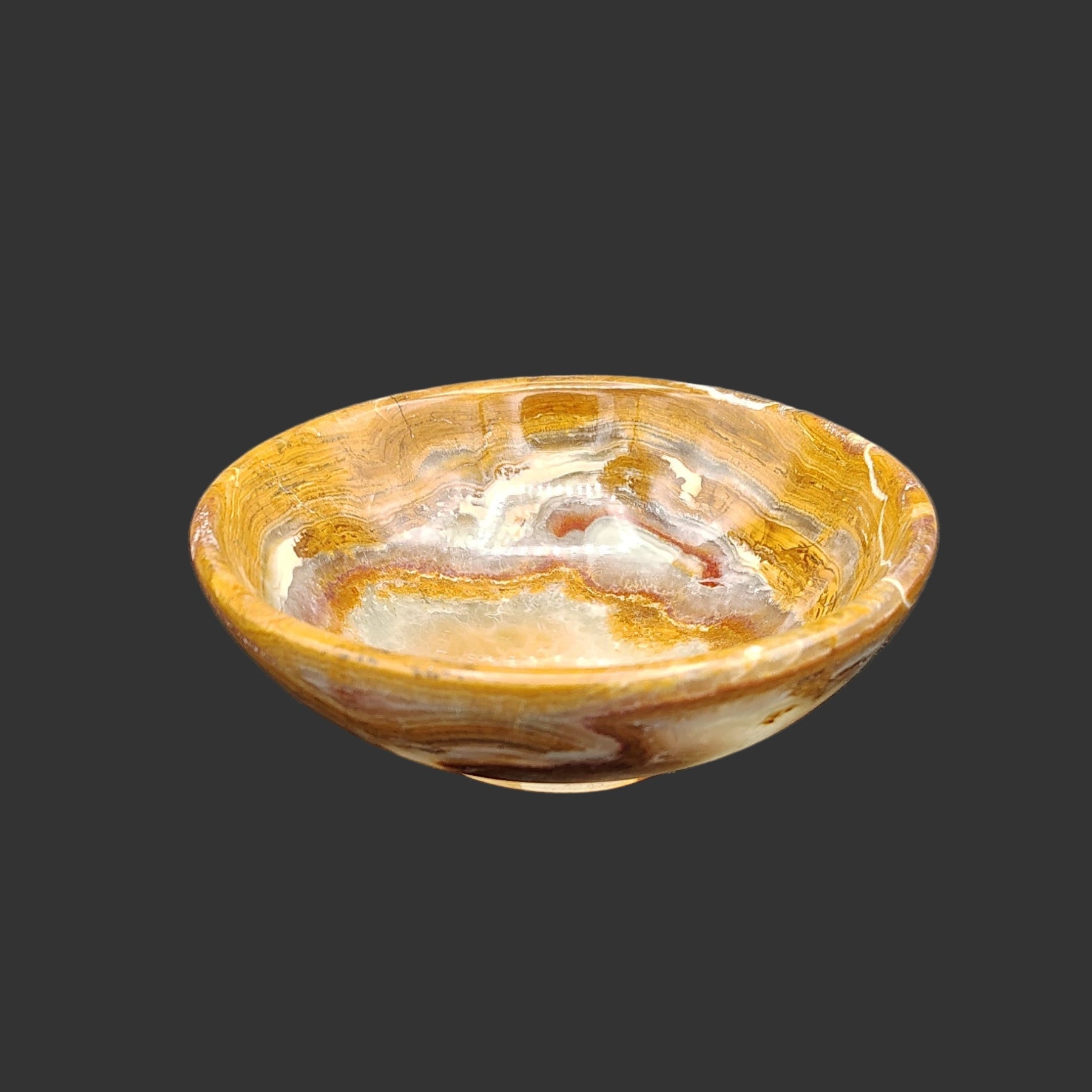 This is the front side of this small, banded onyx bowl.