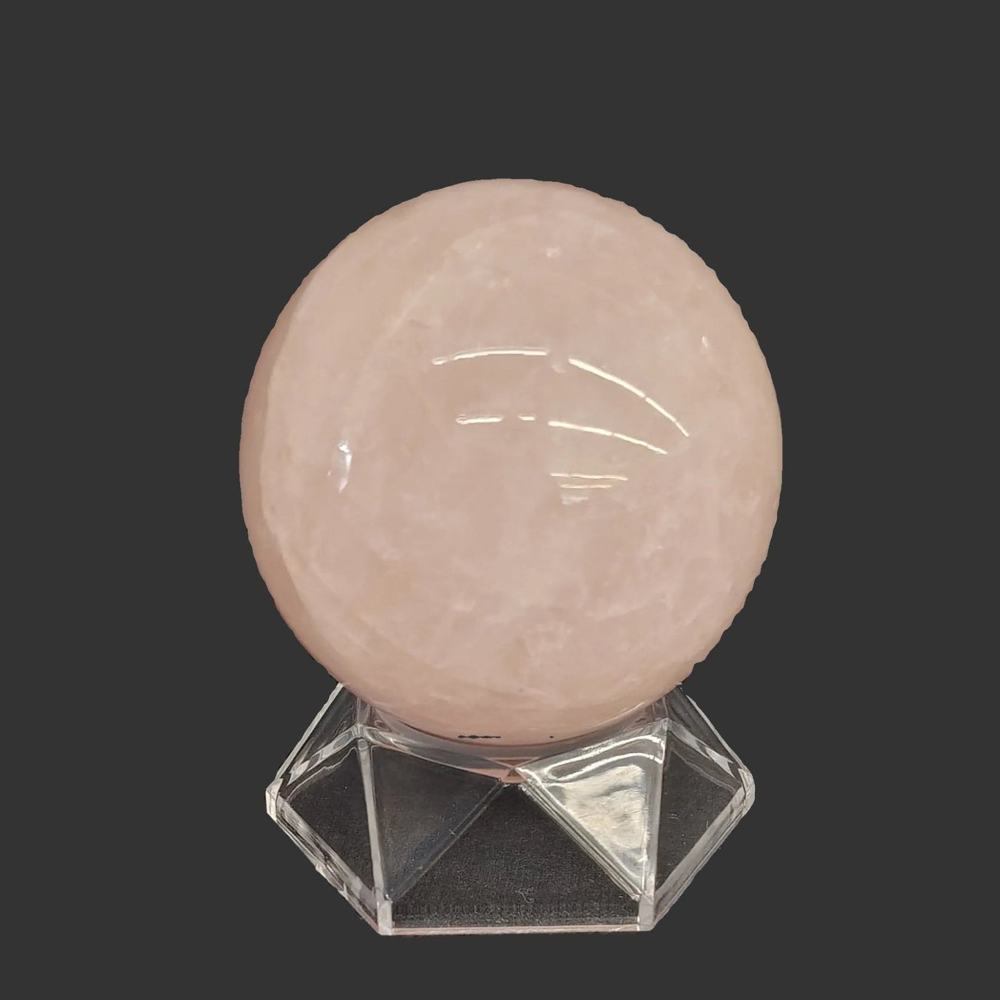 This hexagon shaped acrylic stand works perfectly for this rose Quartz sphere.
