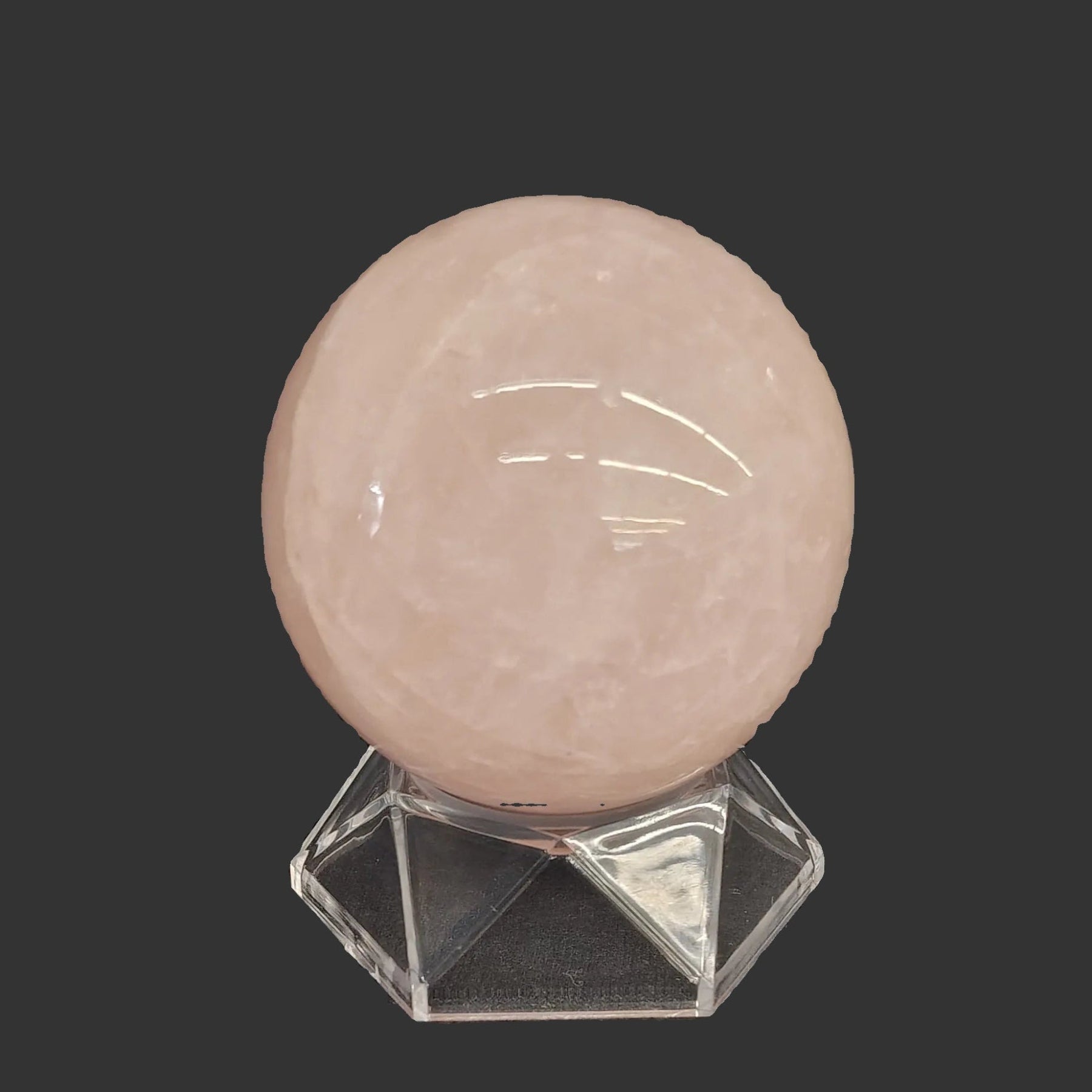 This hexagon shaped acrylic stand works perfectly for this rose Quartz sphere.