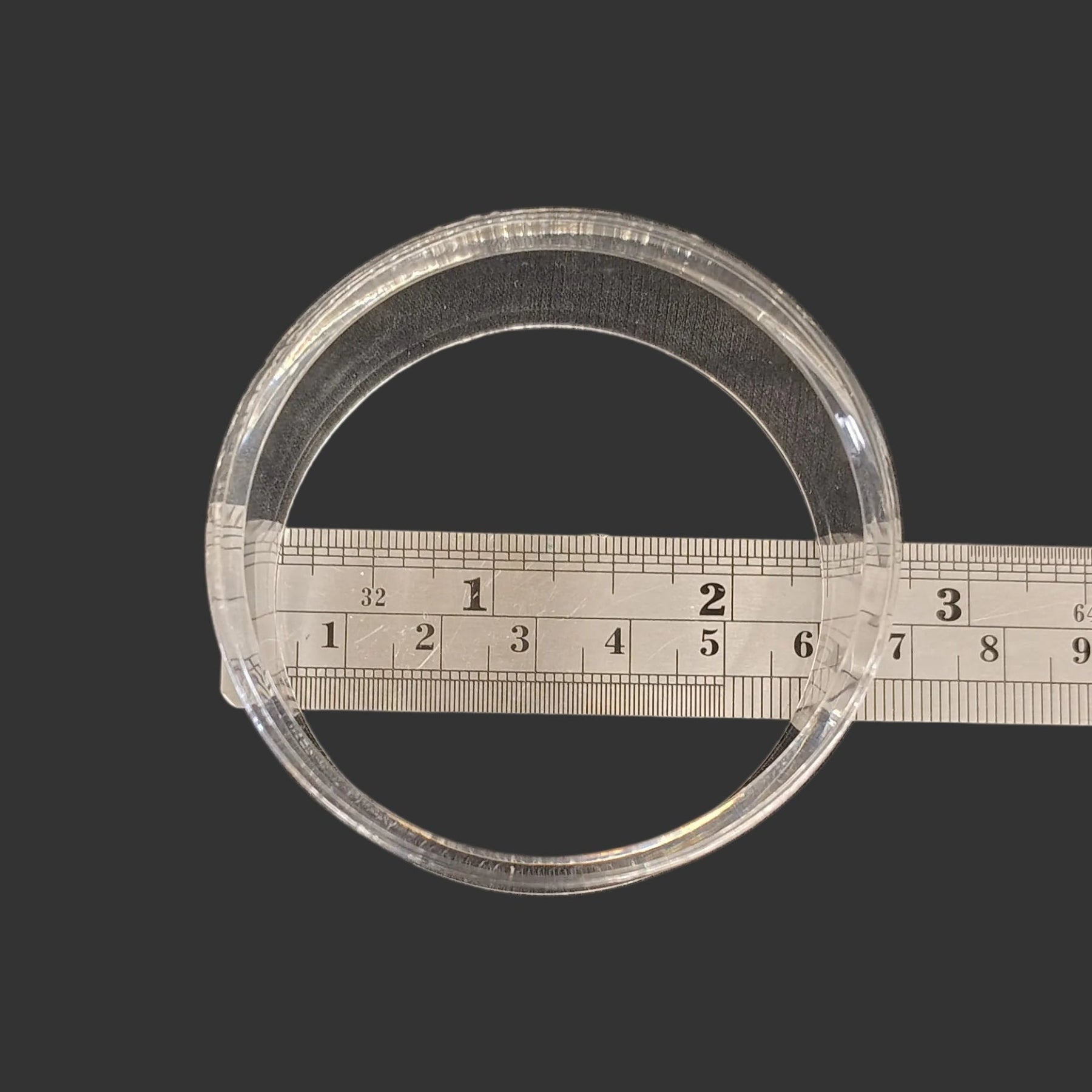 This acrylic riser display stand is 2.50 inches in diameter.