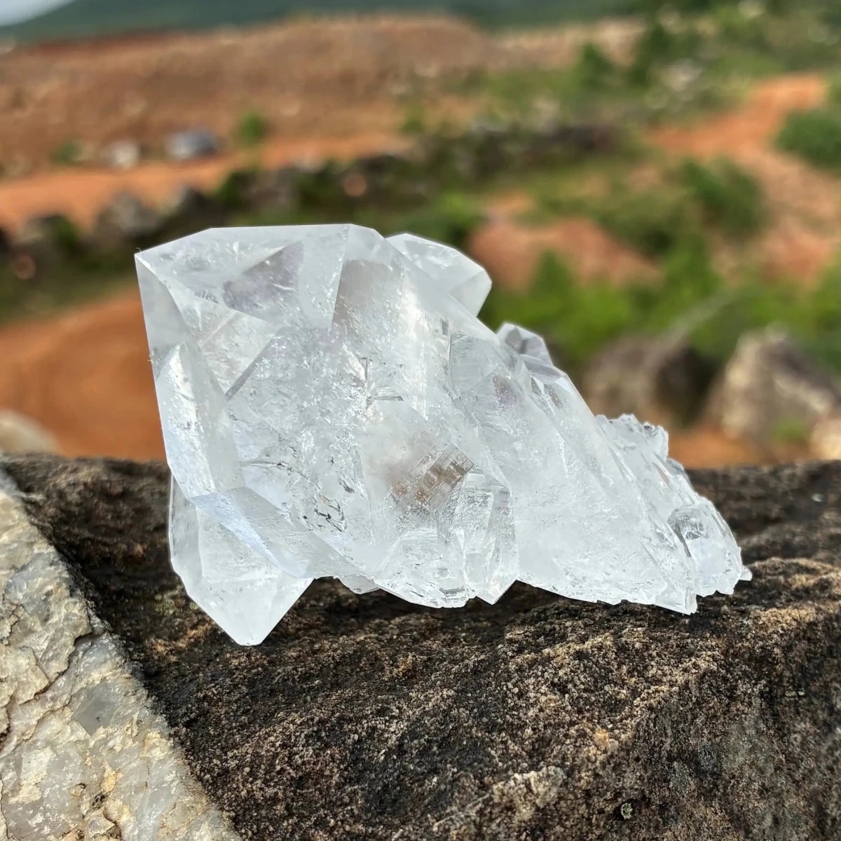 Back side of this double terminated Quartz crystal cluster outdoors.