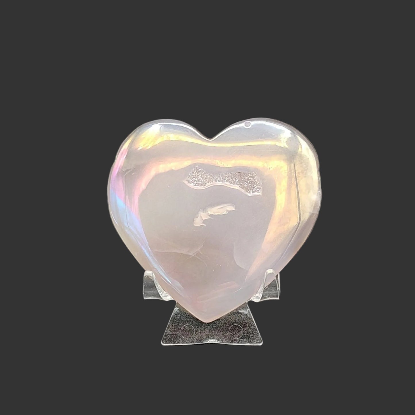 Iridescent front side of this polished drusy Agate rainbow carved heart. 