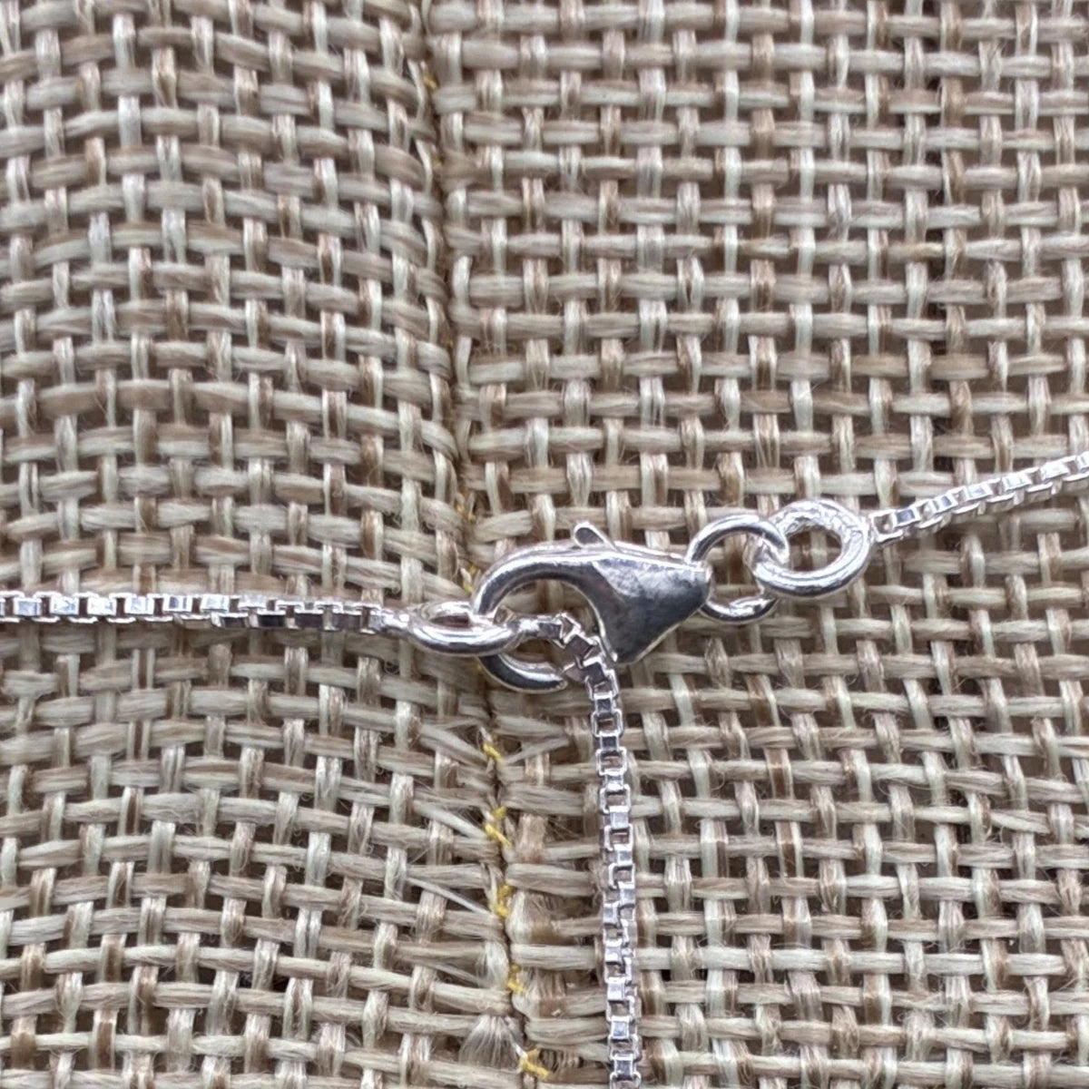 Close up of the lobster claw clasp on this necklace.