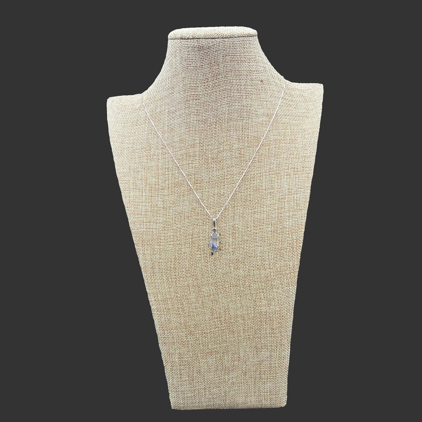 Sterling Silver box chain with a Dumotierite pendant attached.