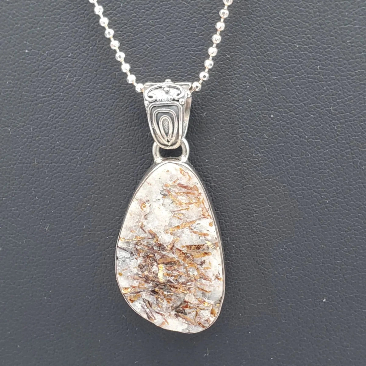 Close Up Of Flash Quartz Pendant