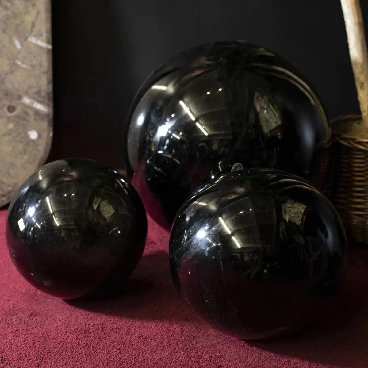 Gold Sheen Obsidian Sphere 23 Inch with smaller spheres in front