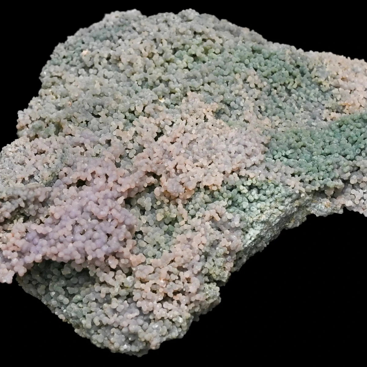 Purple And Green Stone On Black Background