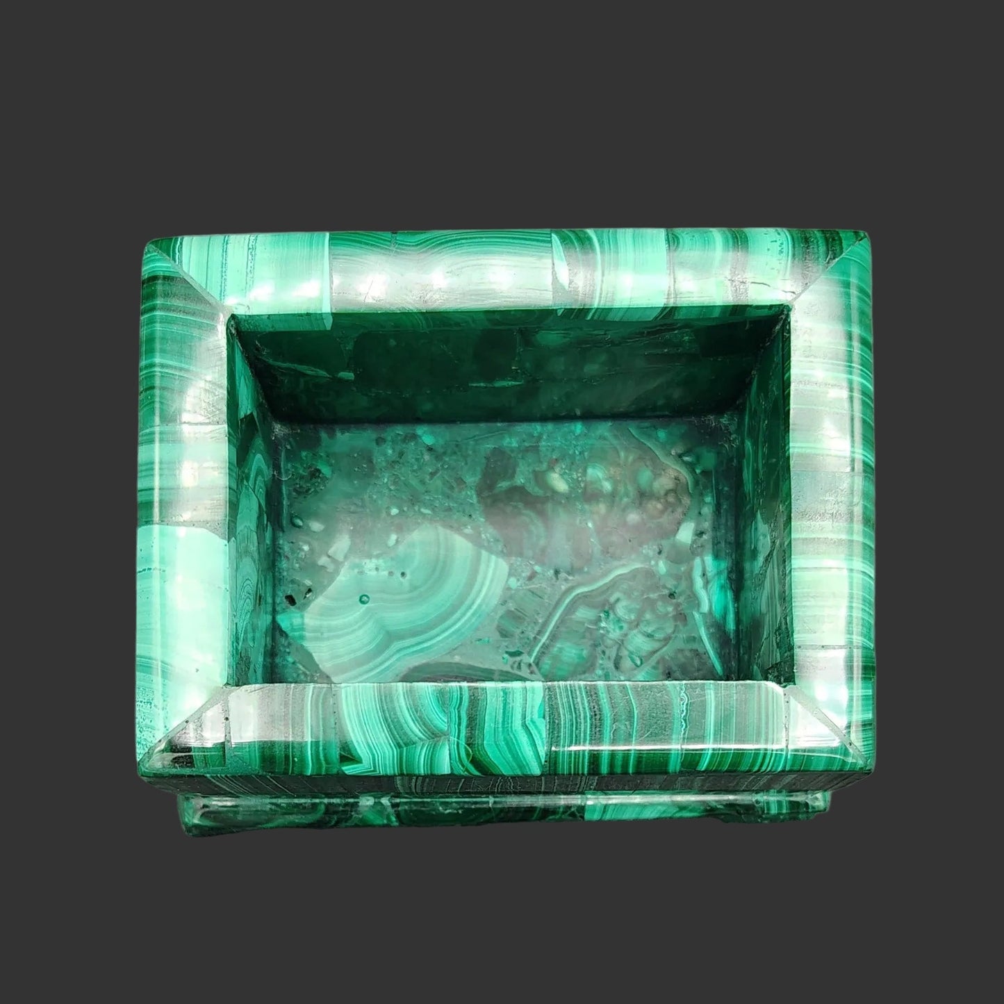 This handmade polished green Malachite trinket box is rectangular in shape.