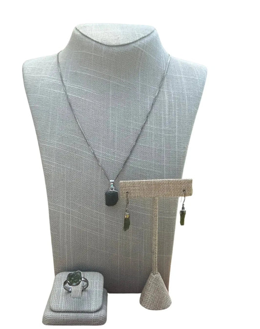 Green Moldavite Pendant Earring Ring Set on display