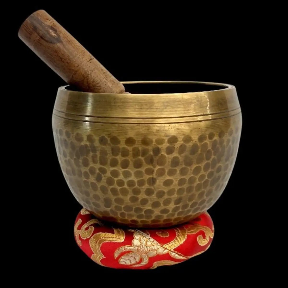 Hammer Singing Bowl Mallet on a donut-shaped cushion