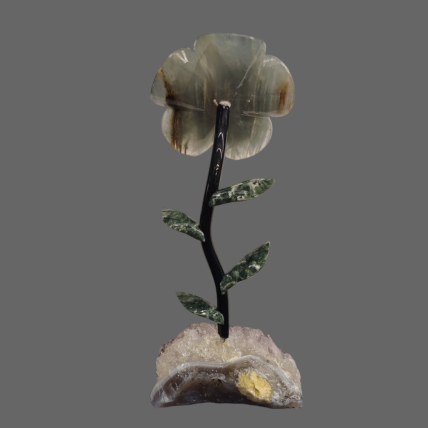 This is the back side of this blue Onyx daisy on a purple Amethyst Quartz base.