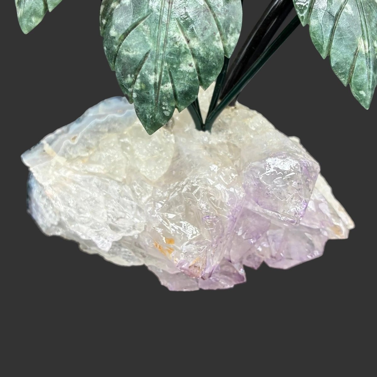 Close up of the purple Amethyst base in front of a black background.