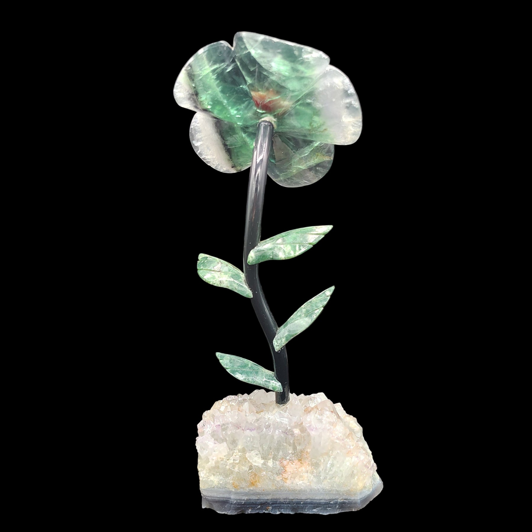 This is the back side of this fluorite daisy on a light amethyst base