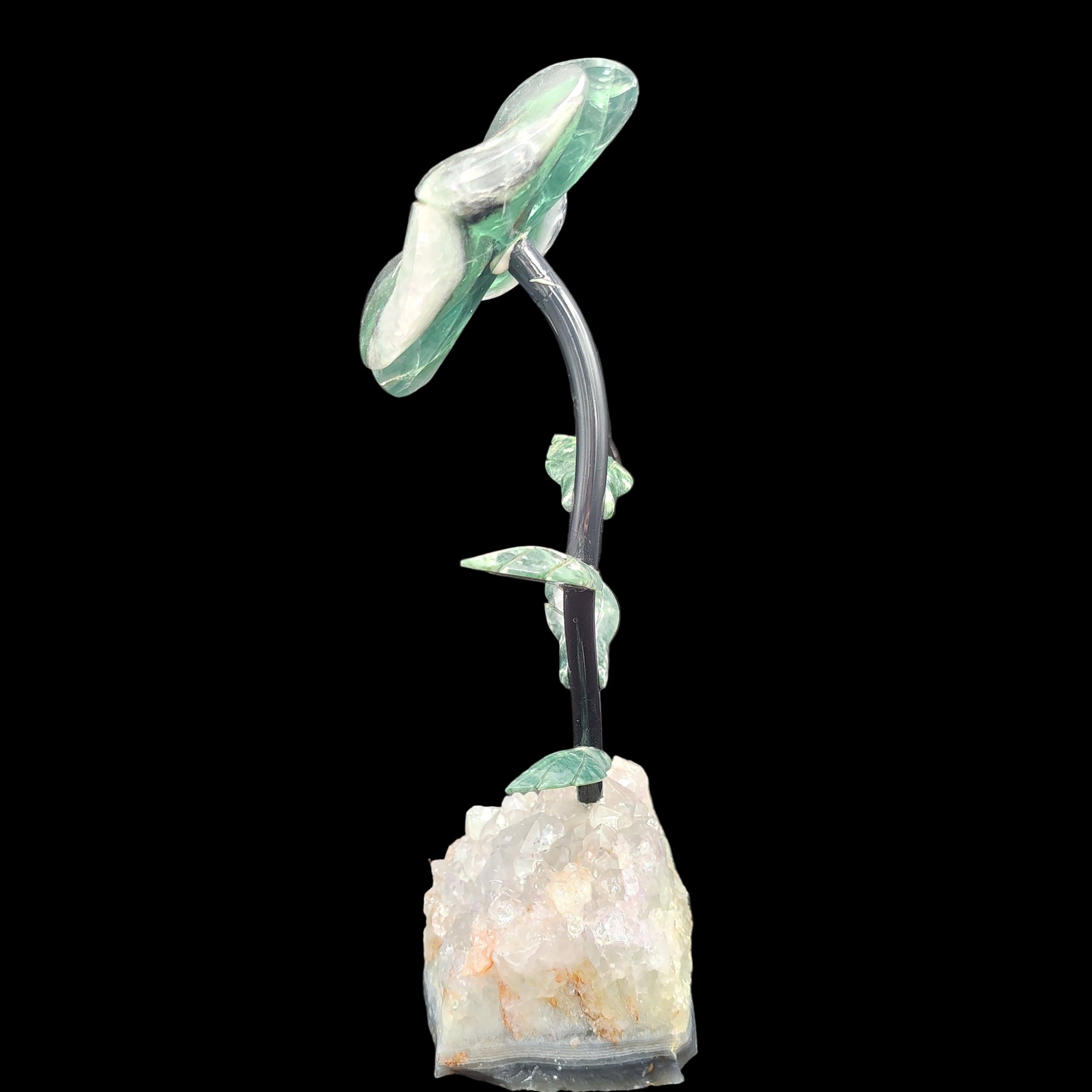 This is the left side of this fluorite daisy on a light amethyst base