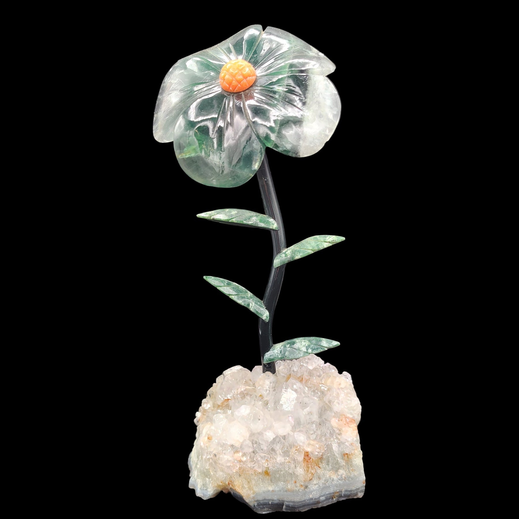 This is the front side of this fluorite flower on a light amethyst base