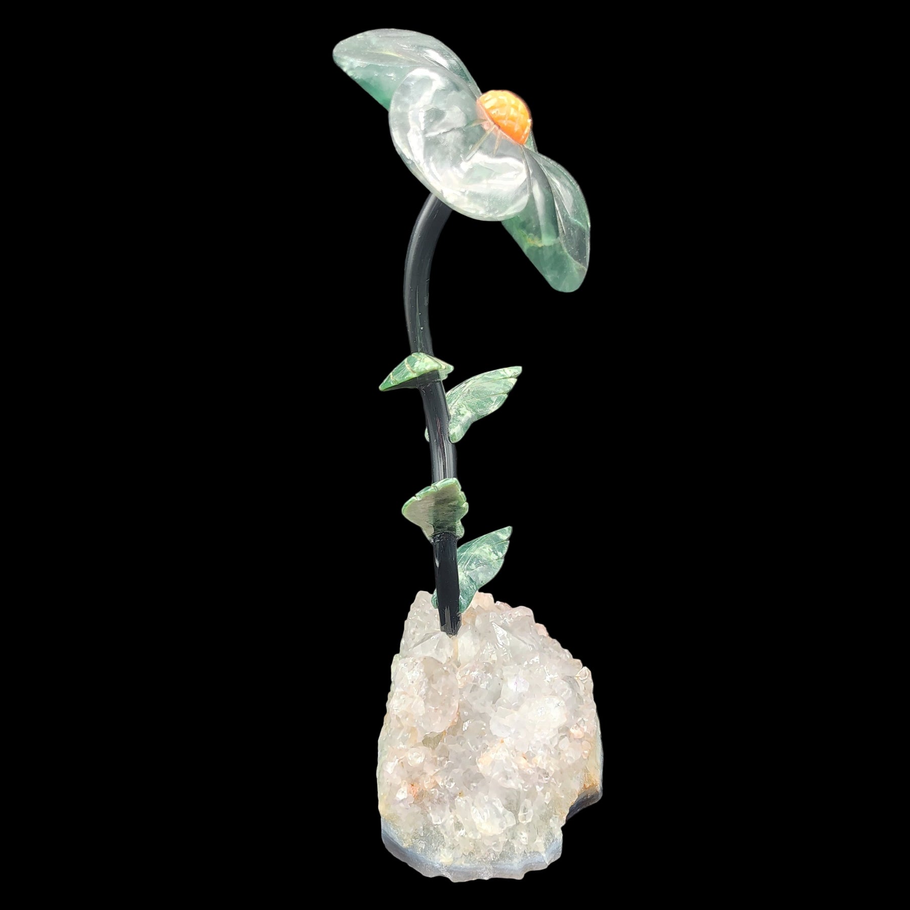 This is the right side of this fluorite daisy on a light amethyst base