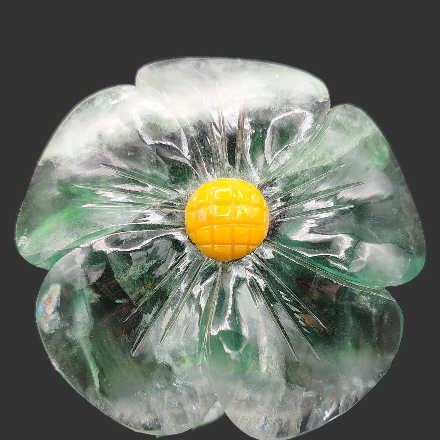 This is a close up of the polished green Fluorite daisy.