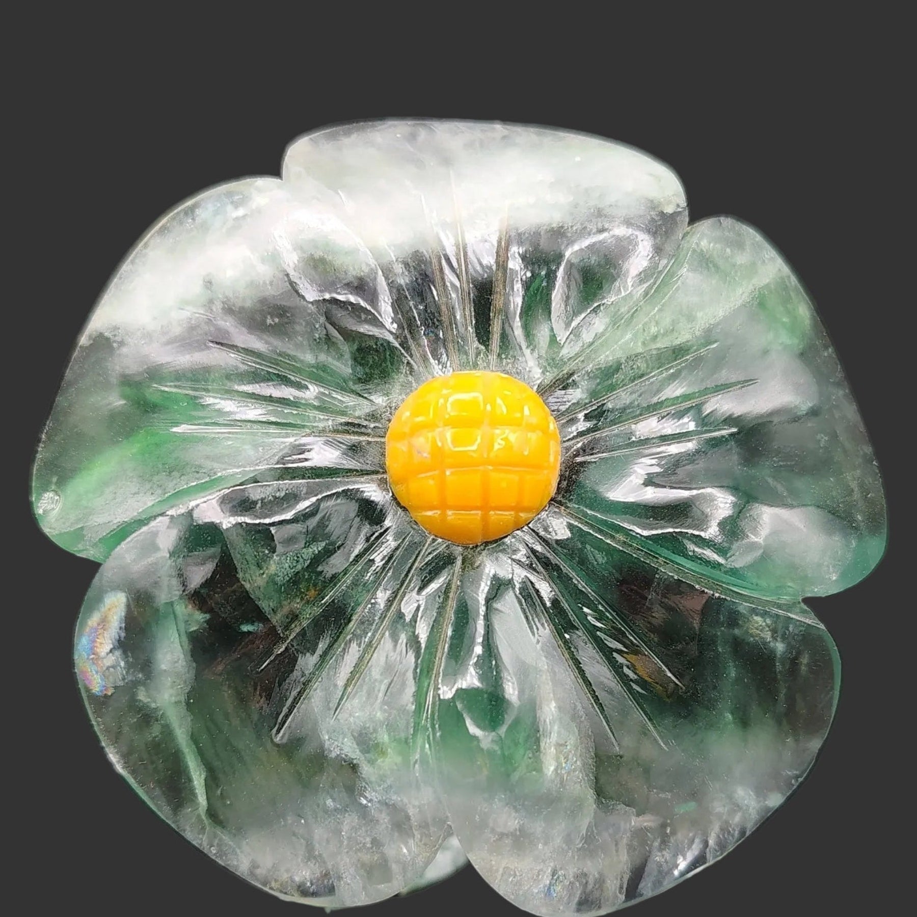 This is a close up of the polished green Fluorite daisy.