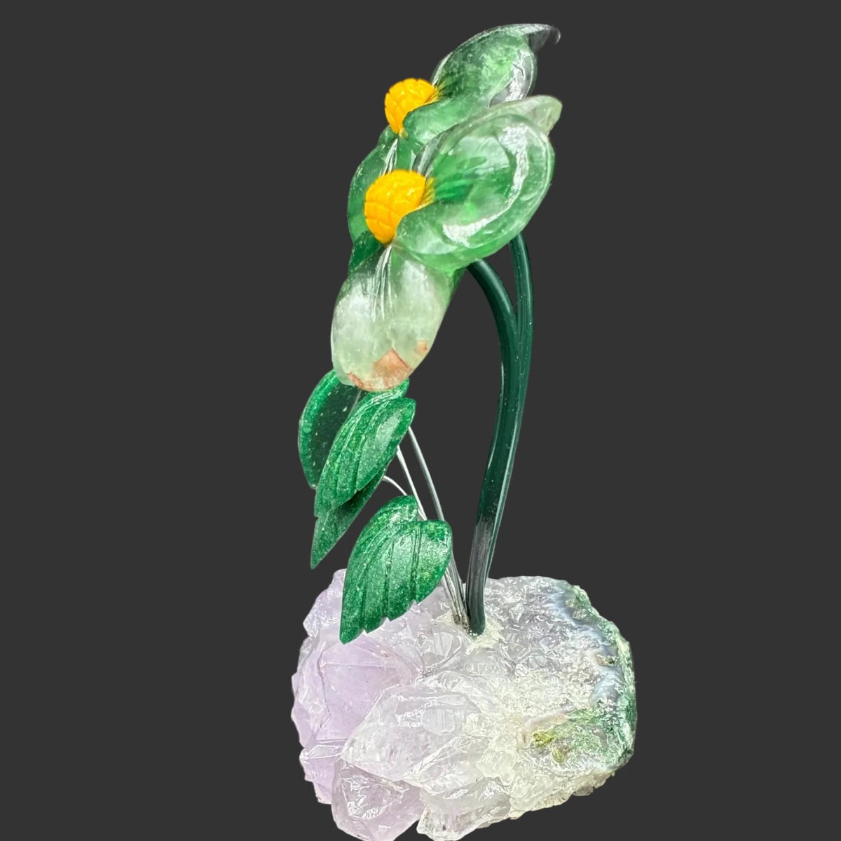 Side view of this polished green Fluorite daisy, in front of a black background.