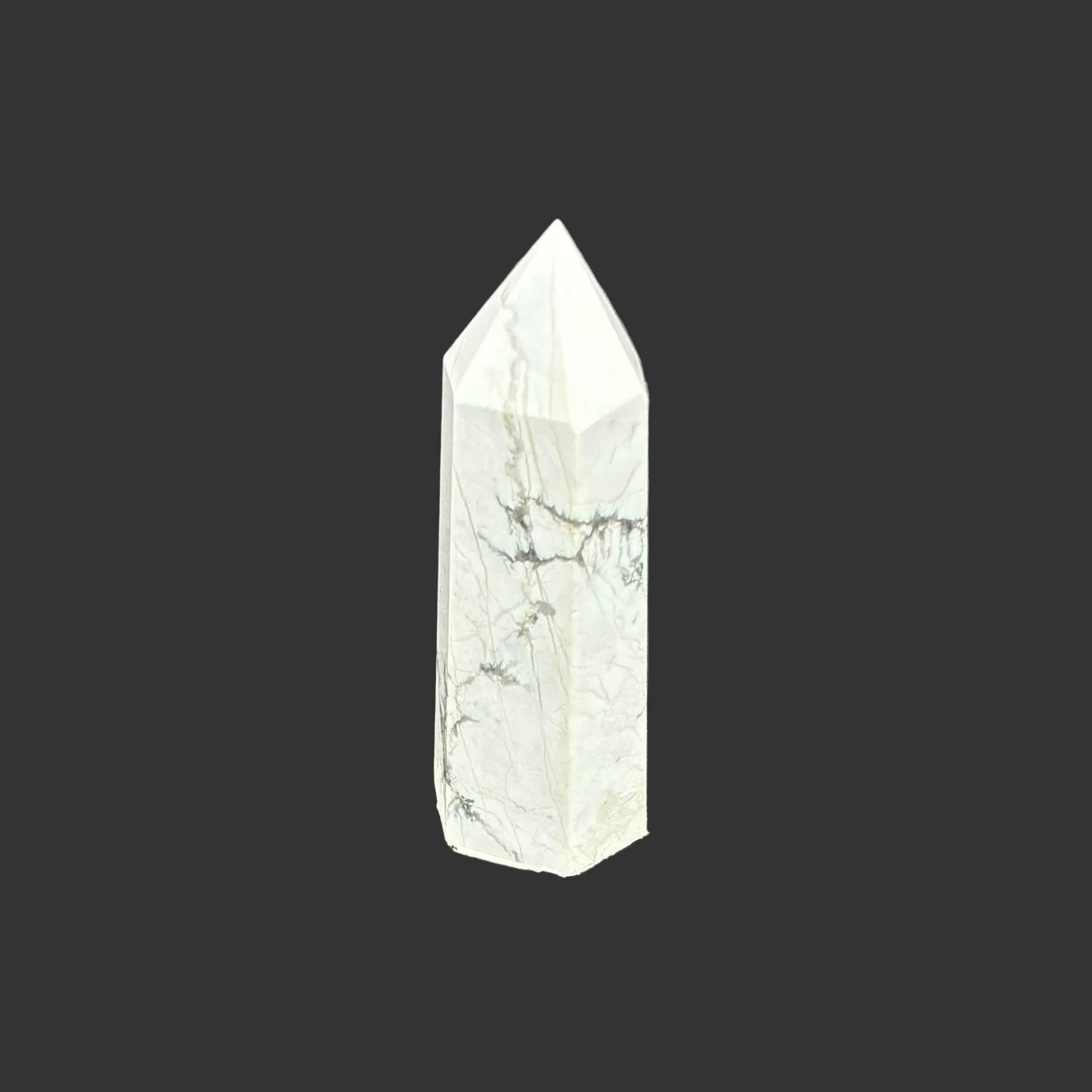 This is the back side of this polished white Howlite tower.