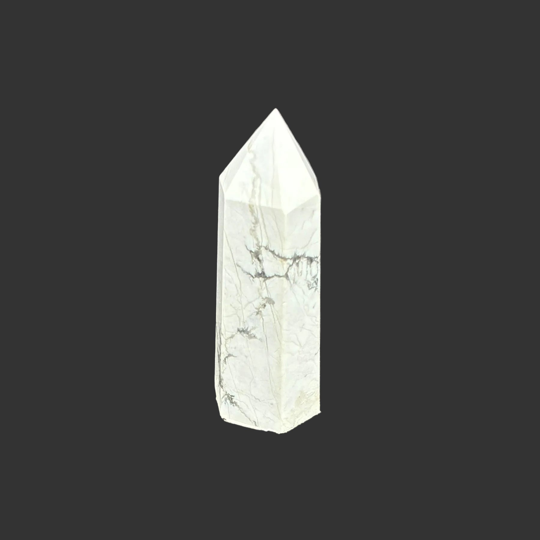 This is the back side of this polished white Howlite tower.