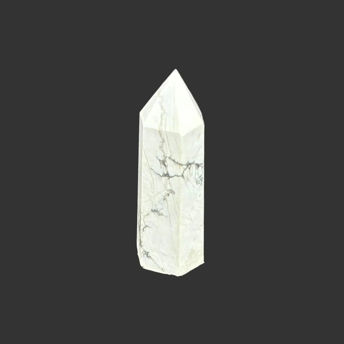 This is the back side of this polished white Howlite tower.
