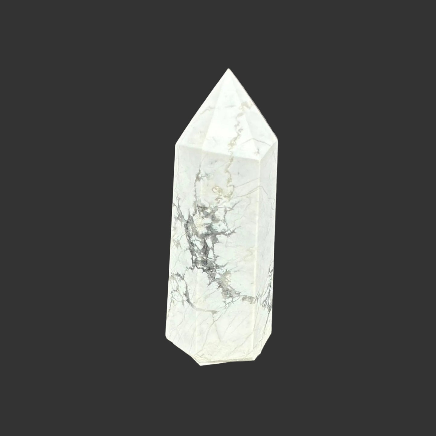 This is the front side of this polished white Howlite tower.