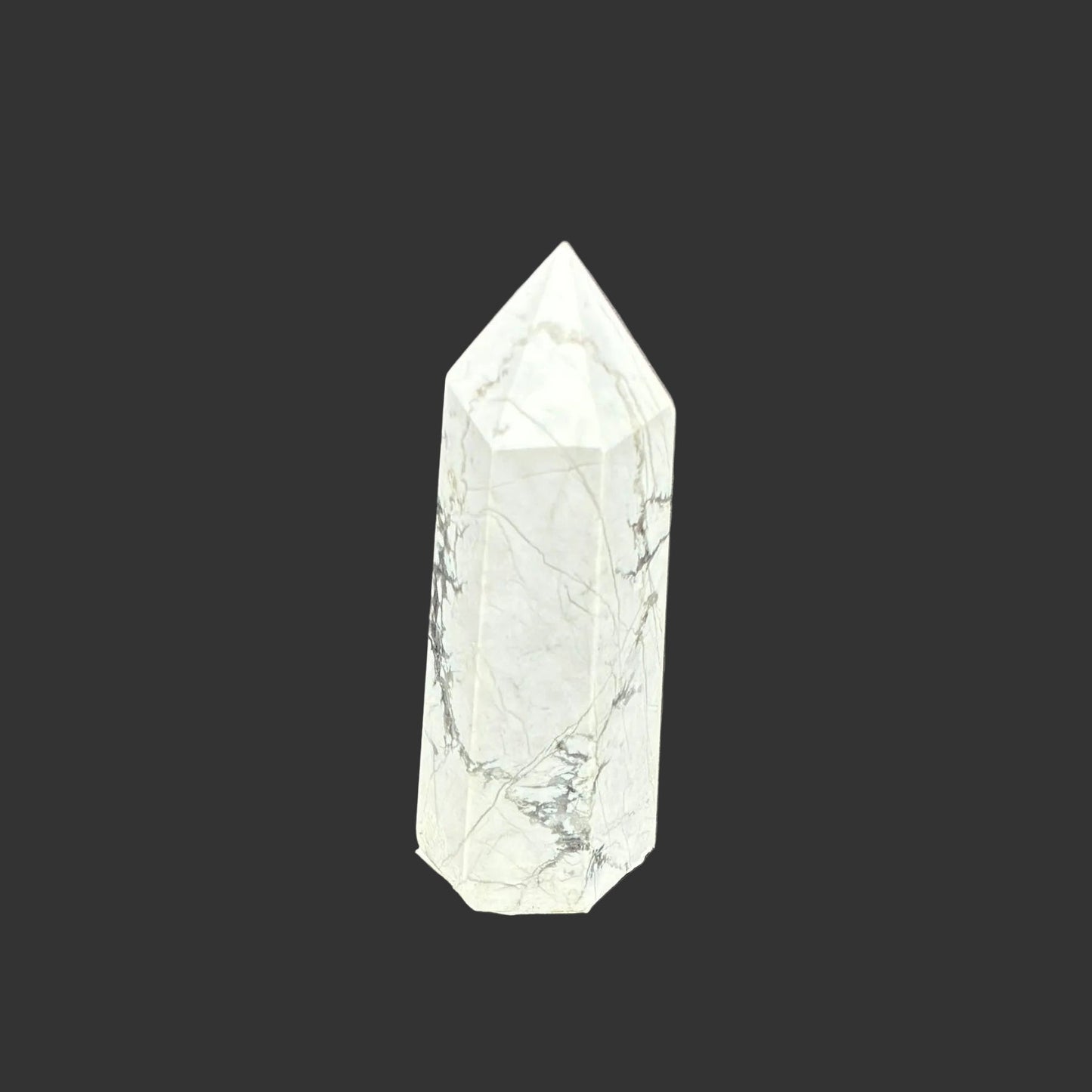 This is the left side of this polished white Howlite tower.