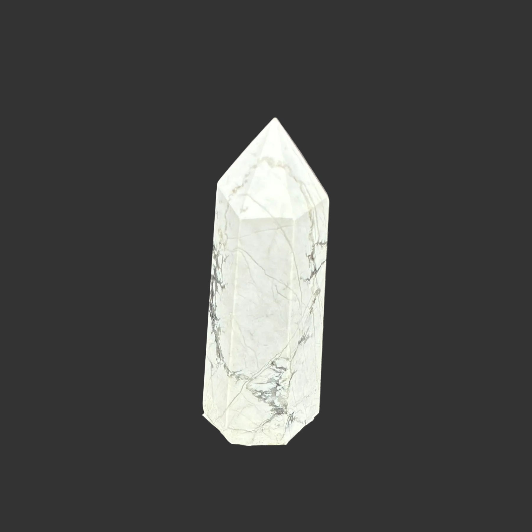 This is the left side of this polished white Howlite tower.