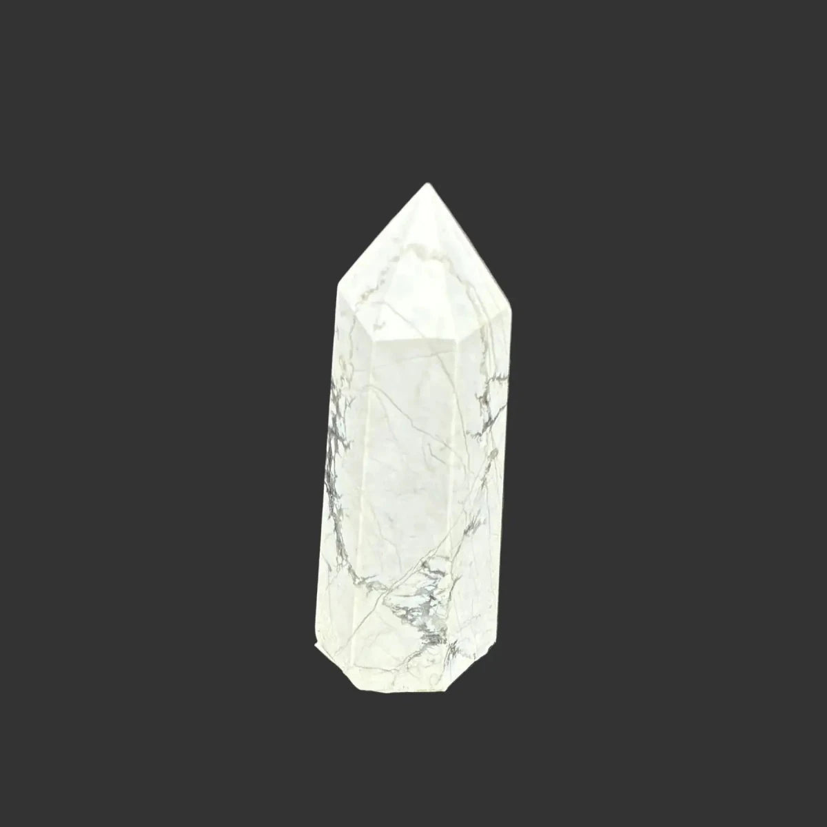 This is the left side of this polished white Howlite tower.