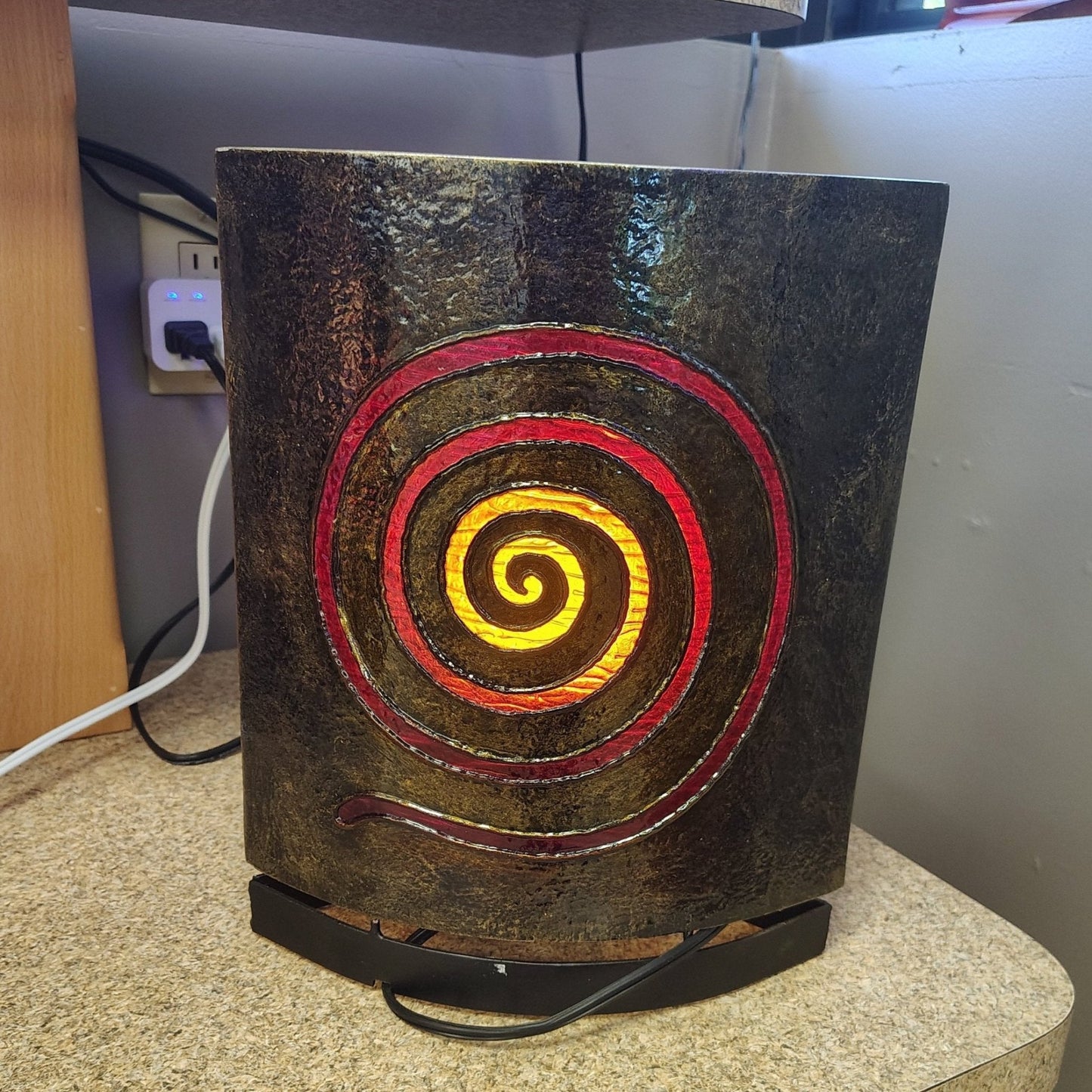 This is the back side view; it is a red and yellow spiral motif made out of acrylic