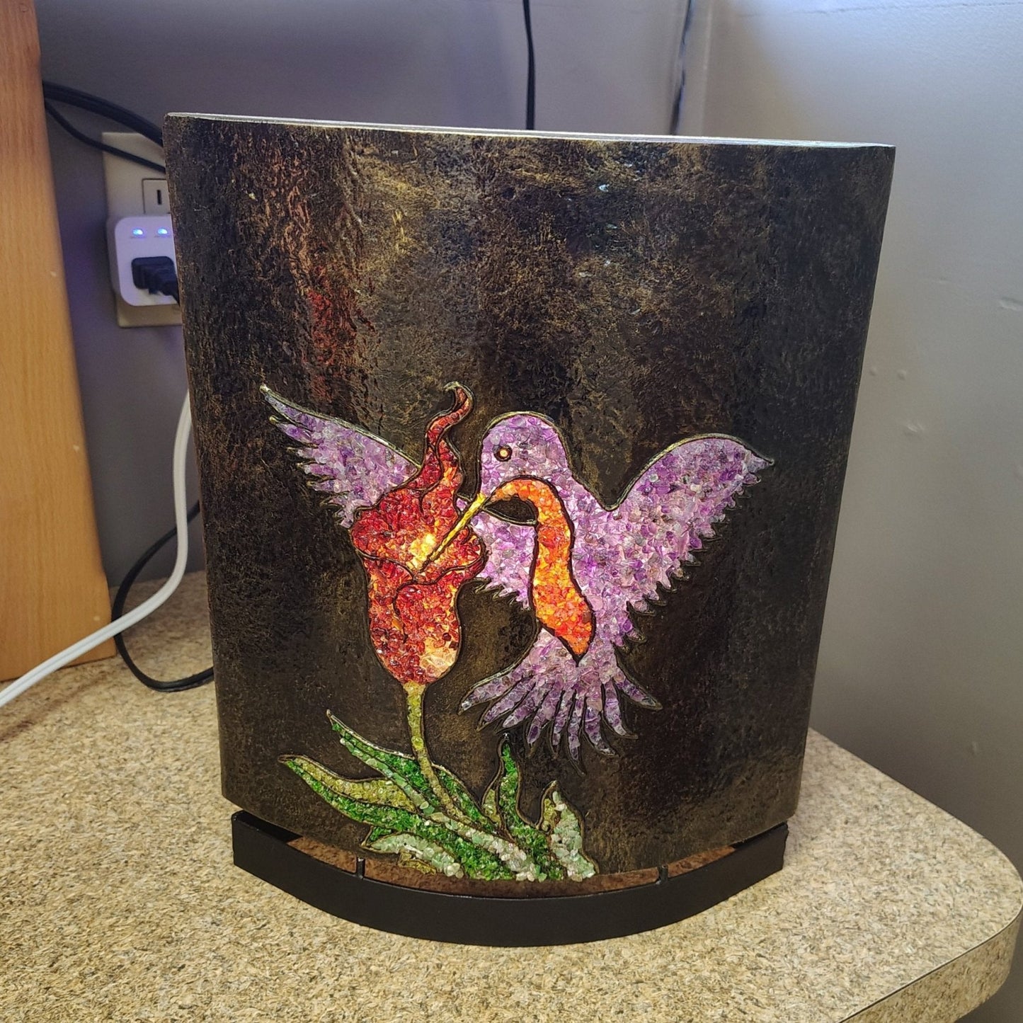 This is the front side view of this resin and gemstone table lamp