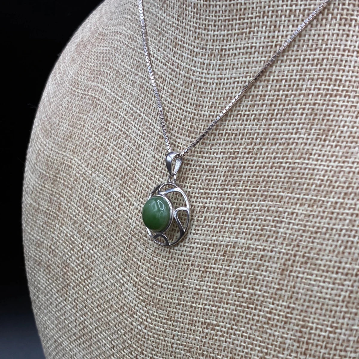 Up close side view of this sterling silver and jade necklace.
