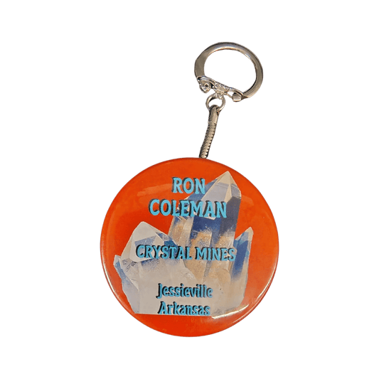 This is the front side of this orange Ron Coleman mining keychain.