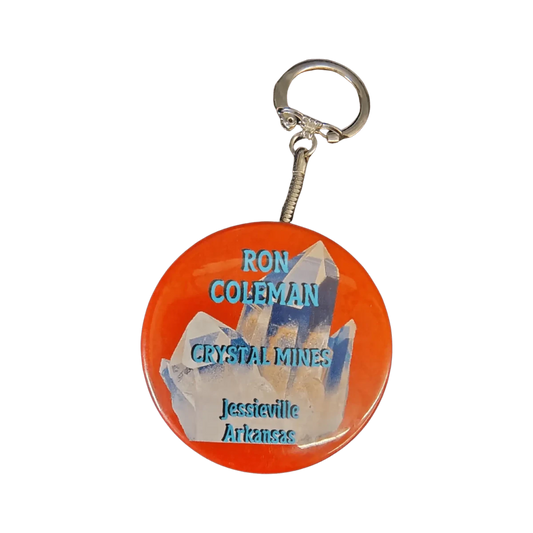 This is the front side of this orange Ron Coleman mining keychain.