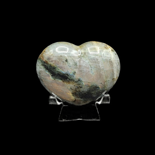 This is the polished Labradorite heart in artificial light indoors