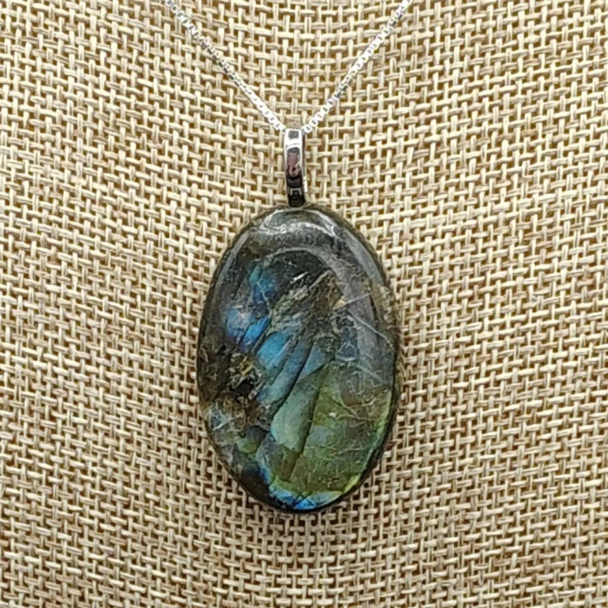 This is a close up of the polished Labradorite pendant