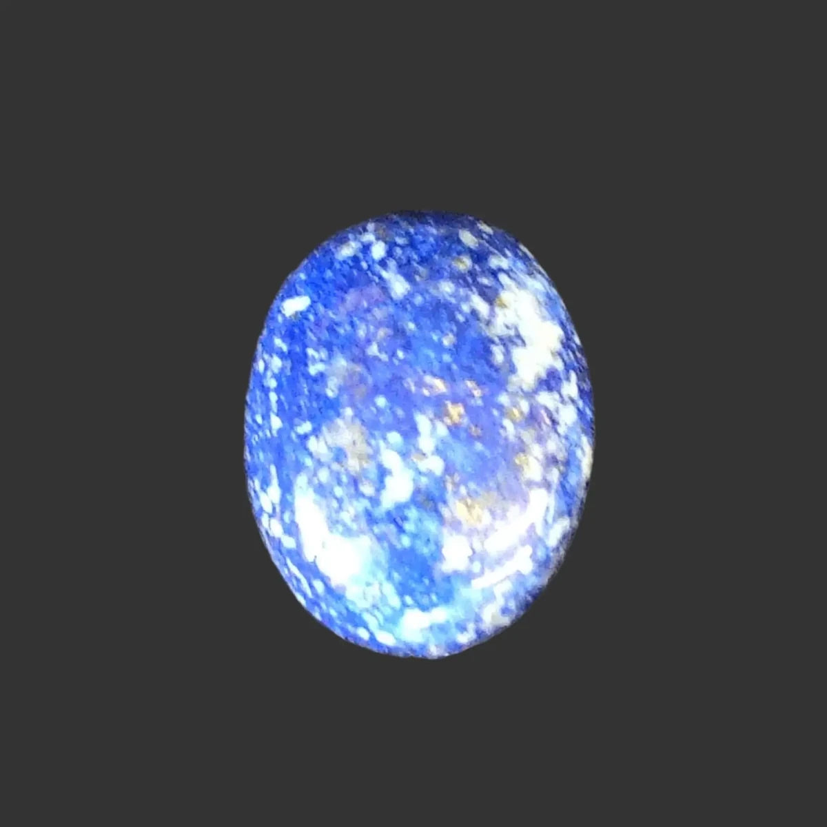 This 4th Lapis cabochon is small oval shaped.