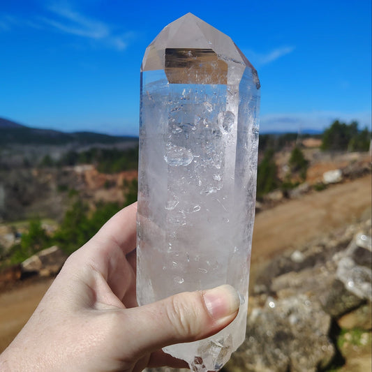 This is the front side of this Quartz Crystal point This side has a little bit of druzy on it.