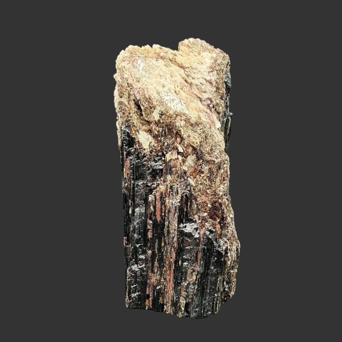 This is the right side of this Tourmaline piece. It is black, cream, and gold in color.