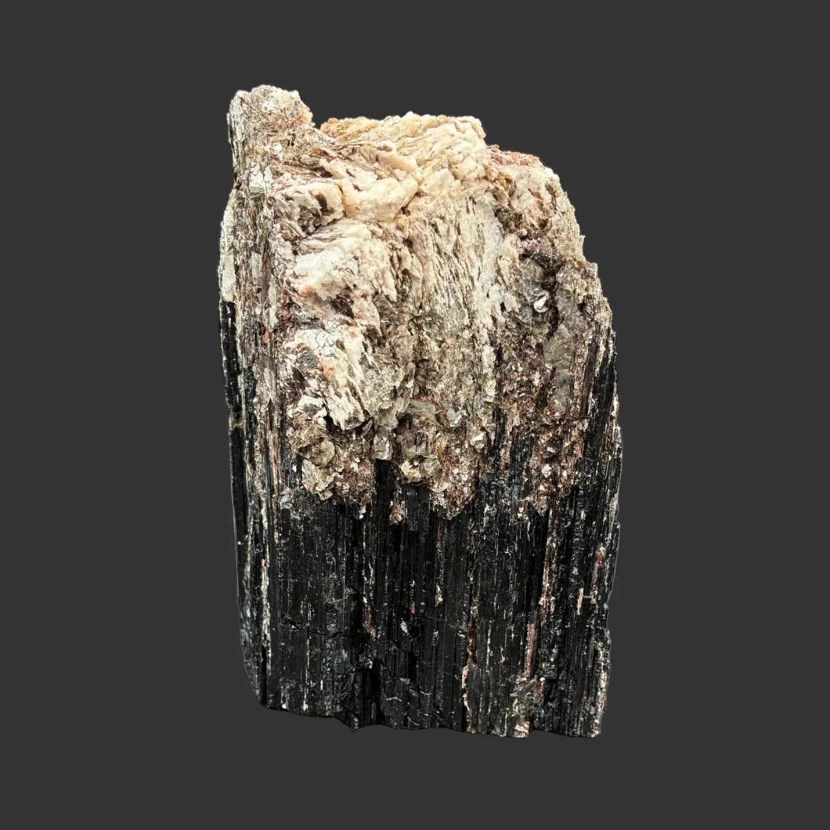 This is the back side of this Tourmaline piece. It is black, cream, and gold in color.
