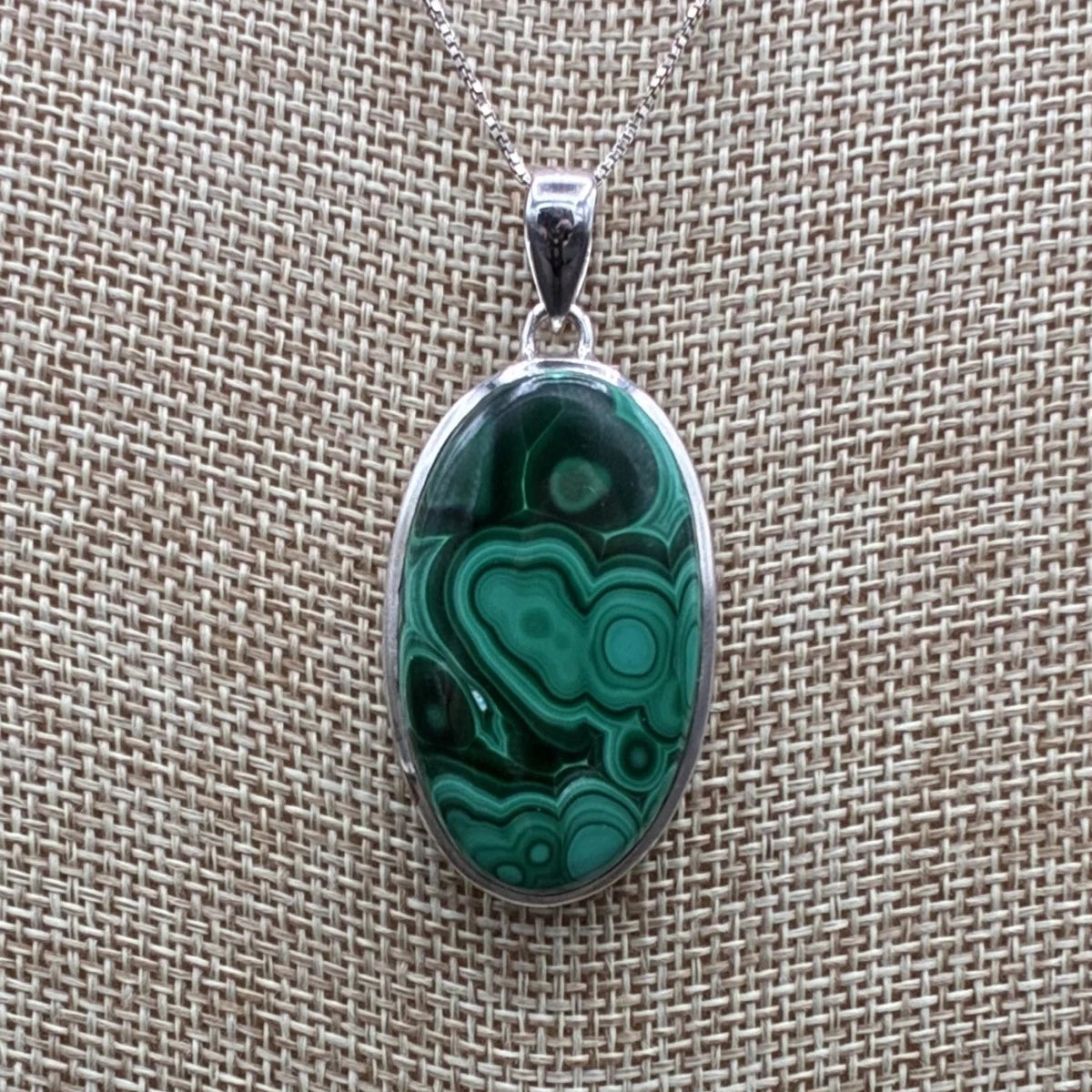 Close up of the sterling silver and malachite pendant.