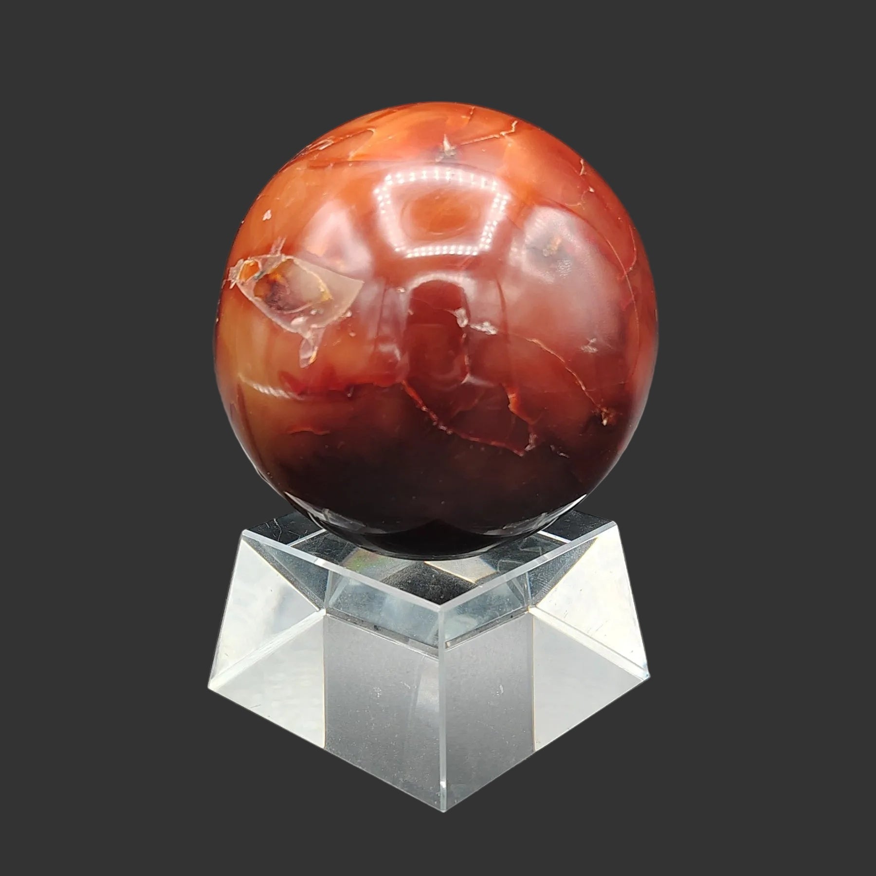 This is the left side of this polished red Carnelian sphere.