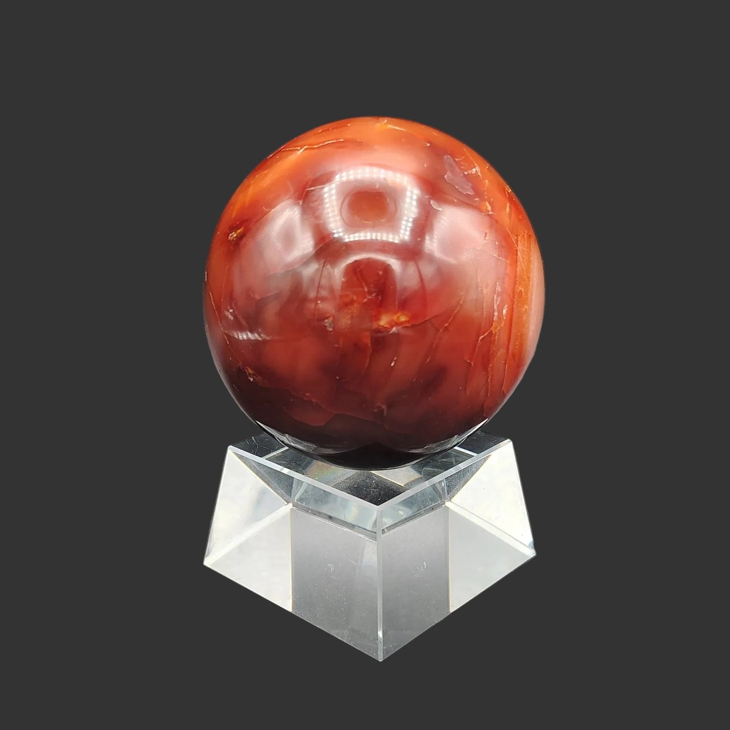 This is the back side of this polished red Carnelian sphere