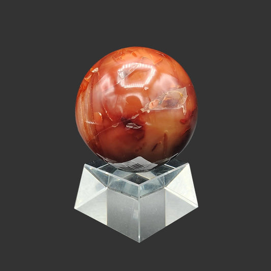 This is the front side of this polished red Carnelian sphere.